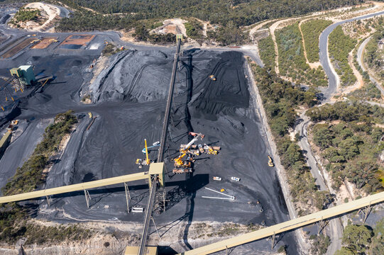 Drone aerial photograph of industrial machinery processing and moving crushed coal in a Colliery in regional Australia.