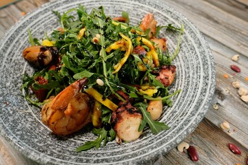 Generous Seafood Mix with Arugula, Sweet Mango, and Pine Nuts Glazed with Balsamic Vinaigrette,...