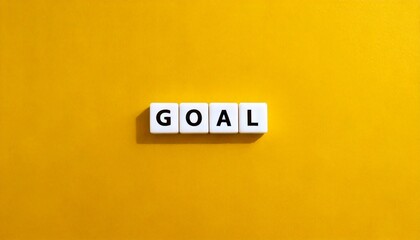 Obraz premium Goal word banner letter tiles on yellow background isolated modern simple aesthetics