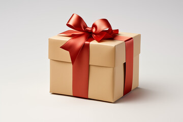 Obraz premium A beautifully wrapped gift box with a red ribbon. Ideal for celebrations, holidays, and special occasions. Perfect for showcasing joy and generosity.