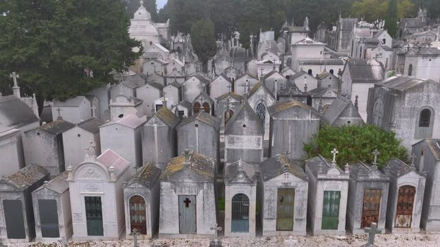 Portuguese cemetery Prazeres in Lisbon, Portugal in Foggy cloudy misty Weather, Aerial Drone shot