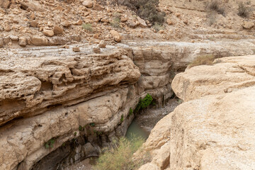Stream  bed runs between the mountains in Arugot Stream Nature Reserve near Dead Sea in southern Israel