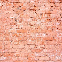 Weathered red brick wall with rustic charm