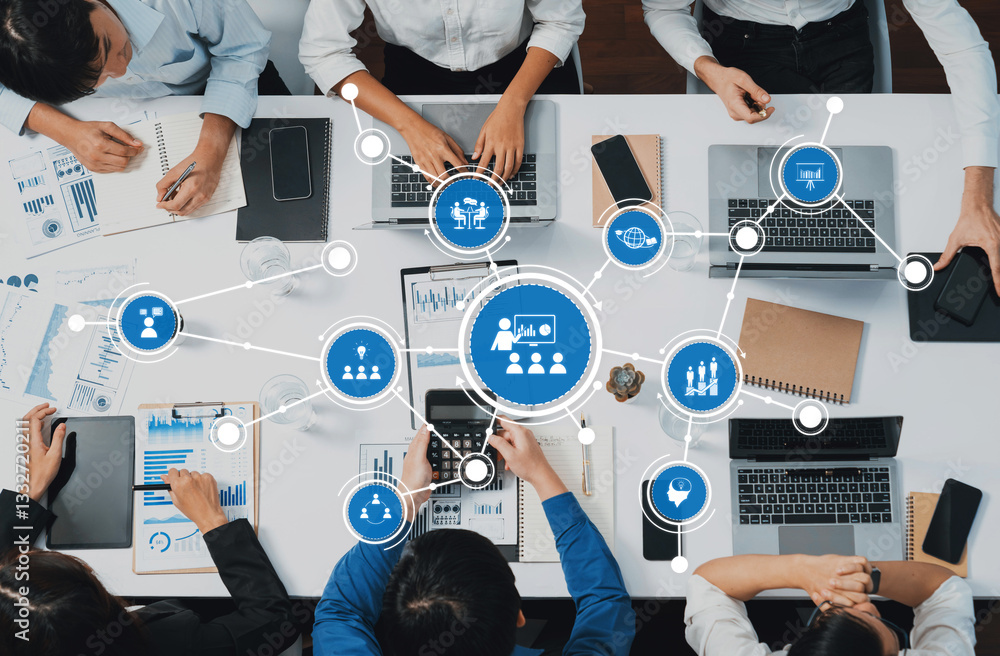 Poster A diverse group of professionals collaborates in a modern office, using technology and data analysis to enhance teamwork, productivity, and strategic planning. Amity