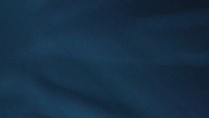 A close up view of a dark blue textured surface with subtle light and shadow variations present