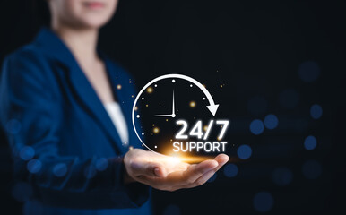 24/7 continuous support service concept. Businesswoman presents glowing icon representing 24/7...