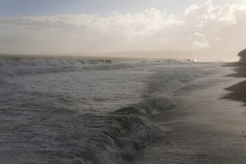 A powerful storm rages across the sea.The unrelenting force of the storm shapes the jagged...