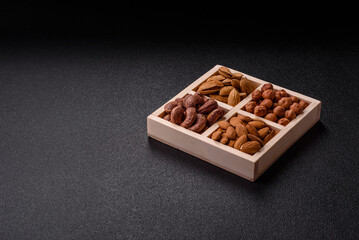 Wooden box with four sections filled with nuts