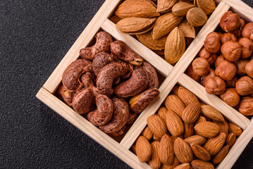 Wooden box with four sections filled with nuts