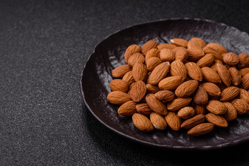 Roasted or raw peeled almonds in bowl