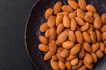 Roasted or raw peeled almonds in bowl