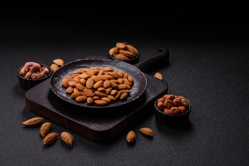 Roasted or raw peeled almonds in bowl
