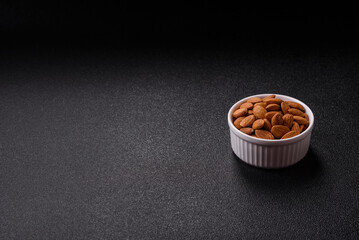 Roasted or raw peeled almonds in bowl