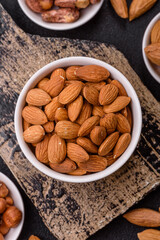 Roasted or raw peeled almonds in bowl