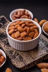 Roasted or raw peeled almonds in bowl