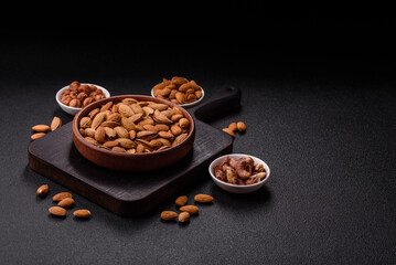 Roasted or raw almond nuts in shell in bowl