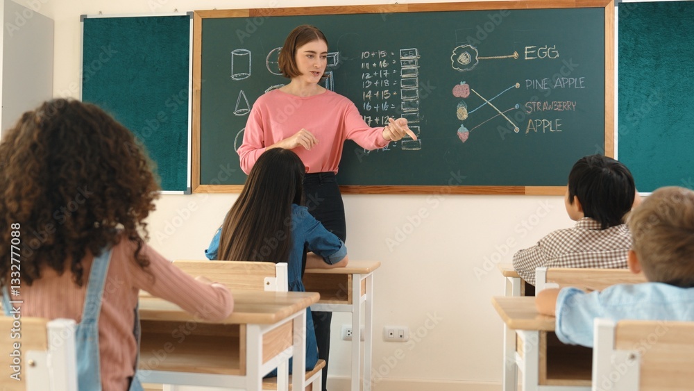 Poster smart teacher checking cute student homework while explaining idea at class. attractive instructor w