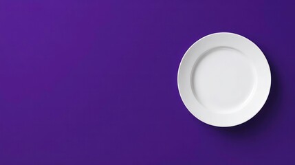 White Plate On Purple Background. A simple white plate set against a vibrant purple background, creating a striking and modern visual contrast.
