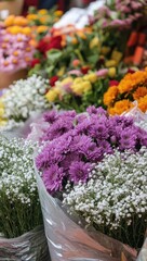 Vibrant Floral Arrangement with Purple Chrysanthemums, Baby's Breath, and Mixed Flowers at a Colorful Market in Full Bloom