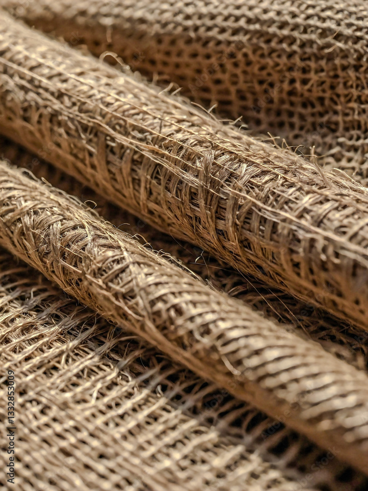 Aufkleber close-up of natural burlap showing texture with soft shadows