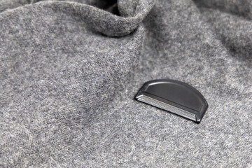 Grey cashmere scarf and brush for wool and cashmere care