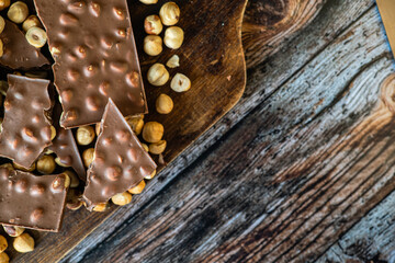 Chopped chocolate with hazelnuts in a warm atmosphere