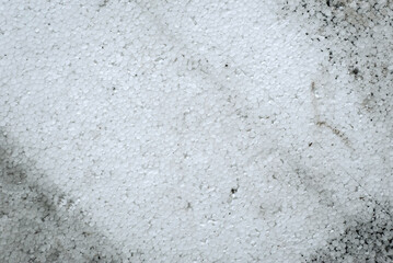 Background, surface texture of dirty old white foam plastic, construction polystyrene. Abstract concept.