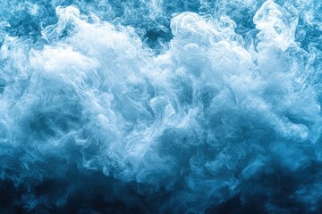 Obraz premium Abstract image of swirling blue smoke, resembling clouds or a nebula, creating a dreamy ethereal effect.