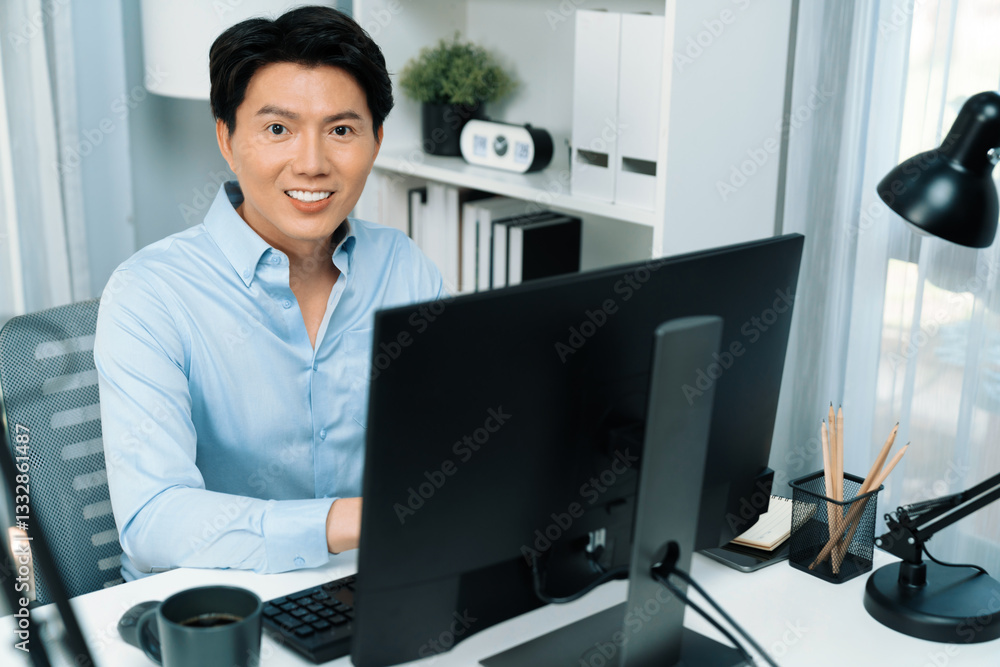 Poster portrait of smart businessman looking camera to pose while working on computer checking email wearin