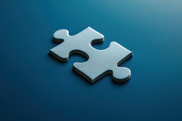 A single silver puzzle piece rests on a blue surface