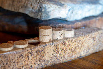 Traditional way of making cork stoppers for wine bottles from cork oak tree close up