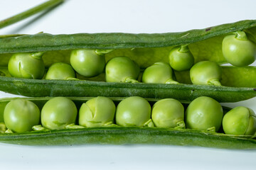 New harvest of fresh ripe green peas legumes