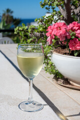 Celebration, birthday party, drinking of cold dry white wine in vacation resort Costa Adeje, Tenerife, Canary islands winter sun vacation, Spain
