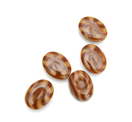 Caramel candies isolated on white background