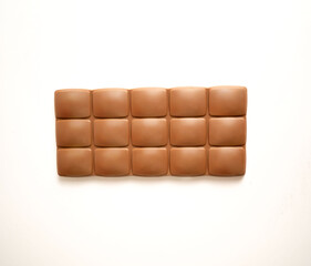 Milk chocolate bar flat lay, top view on white background with clipping path.