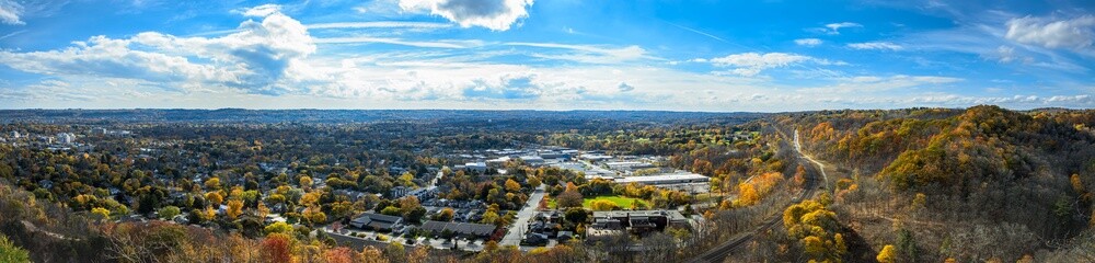 Panoramic Fall colours views of the Spencer Gorge along the Dundas Peak trail in Hamilton and the Dundas village with a train in the railway,  Ontario, Canada.