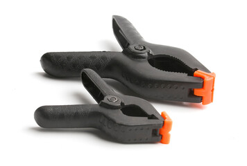 Obraz premium construction clothespins on a white background