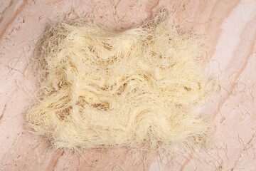 dry kataifi dough on light background