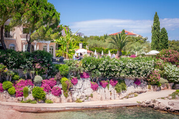 Rustic Stonewall Adorned with Flowers on the Croatian Coast
