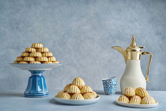 Assorted semolina maamoul or mamoul cookies with dallah . Traditional arabic Eid al Adha, Eid al Fitr sweets