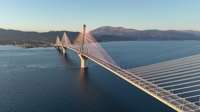 Sunset aerial view of the Rio Antirrio bridge also know as Charilaos Trikoupis connecting Peloponnese and mainland Greece