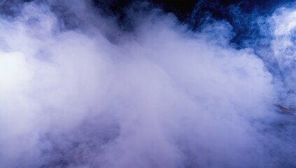 Fototapeta premium Close up of swirling smoke against a clear blue sky