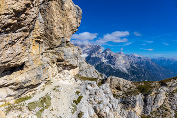 Dolomite Alps mountains in Europe beautiful landscape photo. Stunning rocky peaks of Dolomiti Alps under clear blue sky cliffs and climbing walls of European Alps scenic view