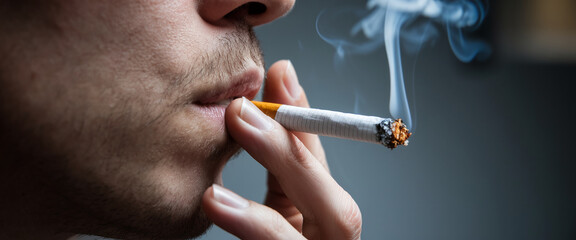 Close-up of a person smoking a cigarette, smoke exhaling, depicting a moment of addiction and its consequences, representing health risks and harmful habits
