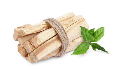 Palo santo sticks with fresh green leaves on white background