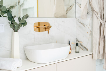 Cozy bathroom sink setup with modern faucet and minimalist design in morning light