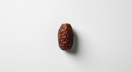 Single Dried Date Fruit on White Background Close up Studio Shot of Medjool Date