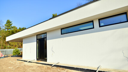 Single family house construction site. Modern designed single-family house under construction.