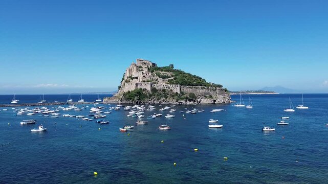 Castello Aragonese di Ischia in estate veduta aerea dalla baia di Cartaromana