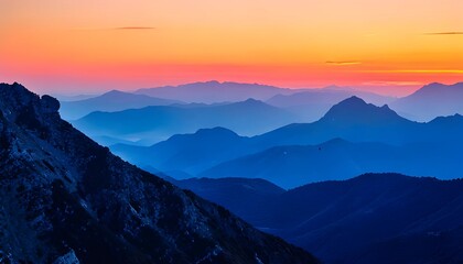 Mountain Range at Dusk with Dramatic Sky and Blue Hues Landscape